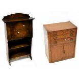 A mid-20th century oak student's desk with fall front and fitted interior above open shelves to the