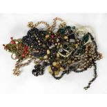 A quantity of contemporary costume jewellery to include bangles, gilt necklaces, bead necklaces etc.