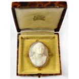 A 9ct gold cameo brooch, the carved shell depicting the head and shoulders of an elegant lady,