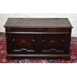 An 18th century oak coffer, with twin panelled front on bracket feet, height 62cm, width 11cm, depth