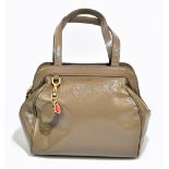 LULU GUINNESS; an unused tan leather 'Paula' hand/shoulder bag with two long handles, gold tone