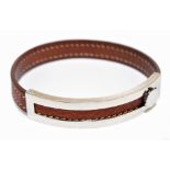 HERMÈS; a brown calf leather and silver tone hardware adjustable bracelet/bangle with white