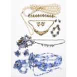 A small collection of costume jewellery to include a jewelled gilt metal bracelet, necklace and