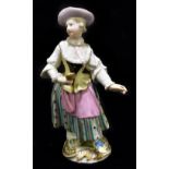 MEISSEN; a mid 19th century figure of a woman holding mirror in her right hand, painted marks to