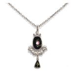 CHARLES HORNER; a George V hallmarked silver and painted black enamel decorated pendant, the pierced