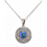 CHARLES HORNER; a George V hallmarked silver and blue/green enamel decorated pendant with circular