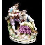 MEISSEN; a late 19th century figure group modelled as a seated female beside a gentleman playing