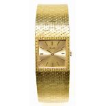 PIAGET; a gentleman's 18ct yellow gold wristwatch with integral textured brick link bracelet and