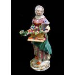 MEISSEN; a mid 19th century figure of a flower seller, painted marks to base and impressed no.35,