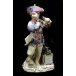 MEISSEN; a 19th century figure of a young gentleman holding a garland of flowers, apparently