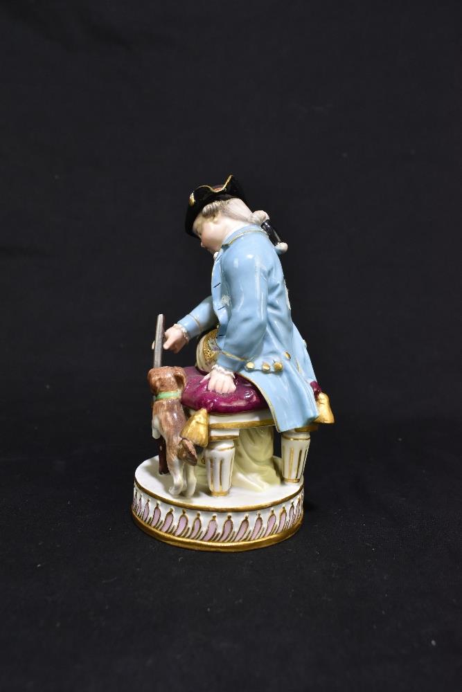 MEISSEN; an early 20th century figure of a seated huntsman with hound by his feet, painted marks and - Image 4 of 8