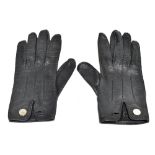 HERMÈS; a pair of Japontag soft black leather lady's gloves with palladium hardware logo discs, size