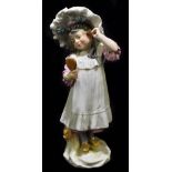 MEISSEN; a 20th century figure of a young girl looking at herself in a hand mirror, painted mark