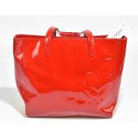 L K BENNETT LONDON; an unused with tags large patent leather 'T T Betty' pillar box red handbag with