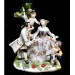 MEISSEN; an 18th century figure group of a young couple with two cupid by their side, apparently