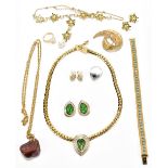 A small group of costume jewellery including bracelet, ring, clip-on earrings.