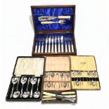 A cased, silver plated fourteen piece set of fish eaters and servers, with silver ferrules, dated