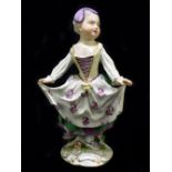 MEISSEN; an 18th century figure of a young girl holding her apron in both hands, painted mark to