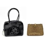 BRUNO MAGLI; a black leather handbag with black embossed horse and rider to front, top handles, gold