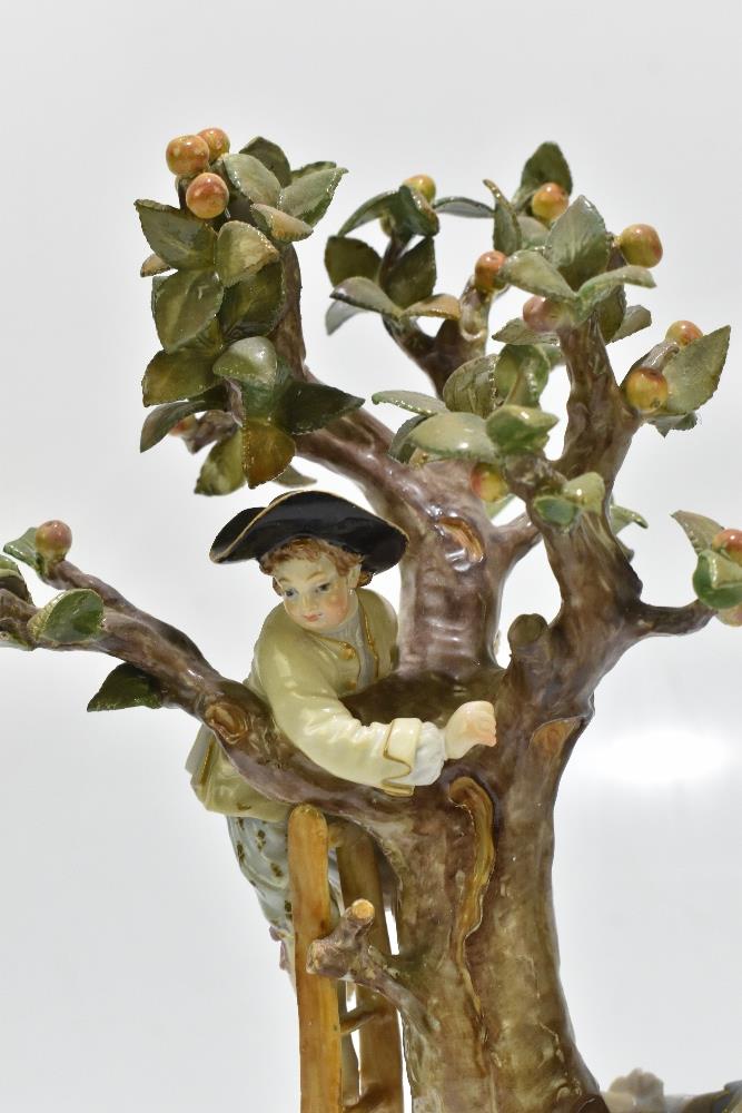 MEISSEN; an early 20th century figure group of a figure picking apples in an apple tree with three - Image 4 of 13