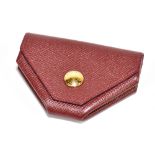 HERMÈS; a burgundy Epsom red calfskin leather coin purse with a gold Cloud de Selle clasp, with dust