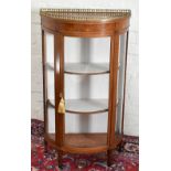 An Edwardian inlaid mahogany bowfront display cabinet with pierced gallery top above marquetry inlay