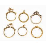 CHARLES HORNER; four 9ct yellow gold pendant mounts each with bail, various hallmarks (6.3g) and two