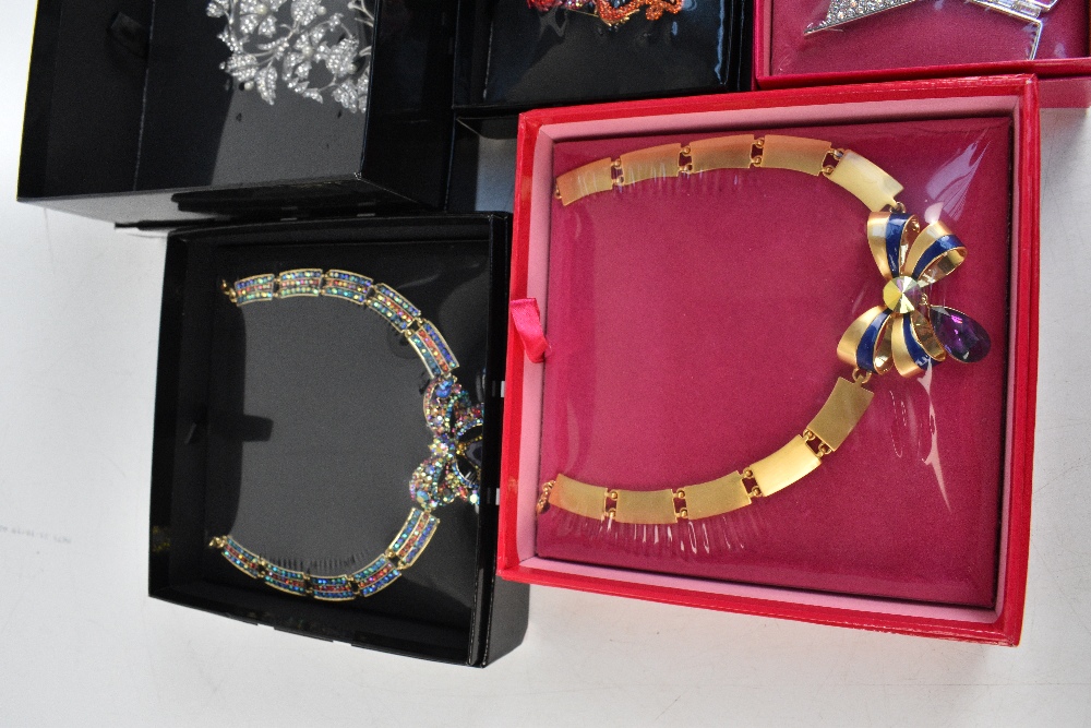 BUTLER & WILSON; an unopened boxed large crystal champagne brooch, 11 x 9cm, a boxed unopened red - Image 2 of 4