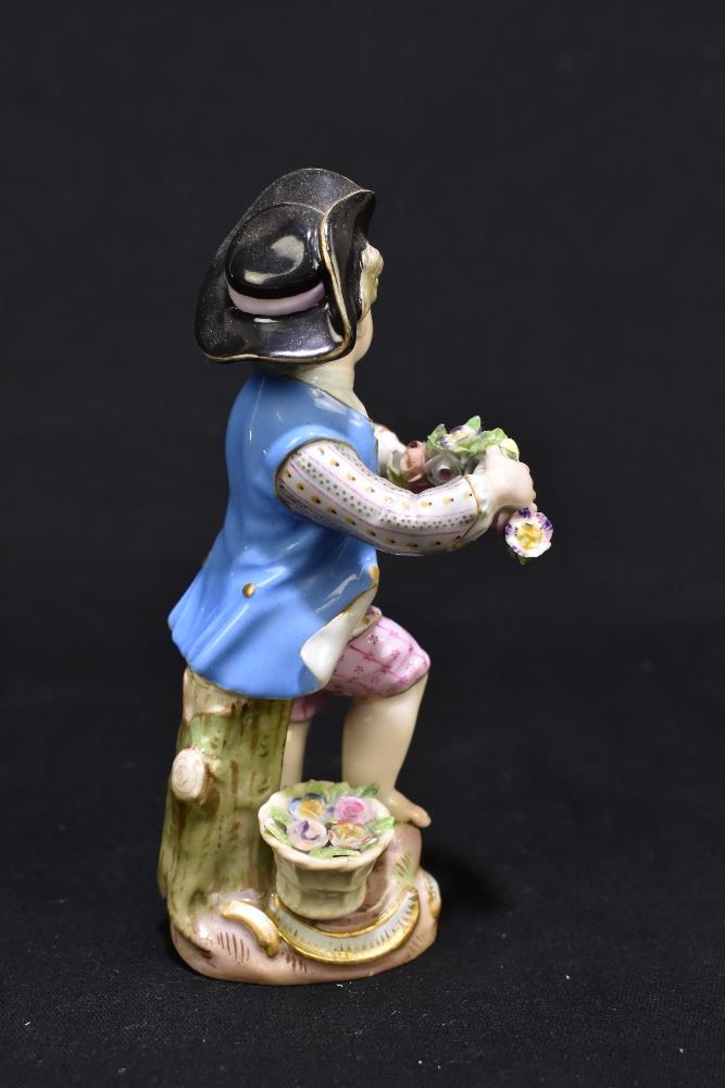 MEISSEN; a mid 19th century figure of a young child holding a garland of flowers, painted marks to - Image 3 of 9