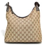 GUCCI; a Monogram cloth G Zipper Hobo Tote vintage handbag with single leather handle, silver tone