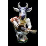 MEISSEN; a 20th century figure of a bull playing the guitar, modelled by Peter Strang, painted marks