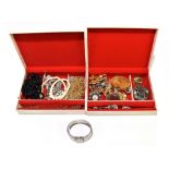 A quantity of costume jewellery including a hinged snap bangle, marcasite brooches, further