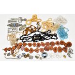 A quantity of assorted costume jewellery including a sterling silver nurse's belt buckle, various