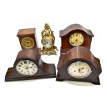 A group of decorative mantel clocks including a brass example, inlaid mahogany example, two dome