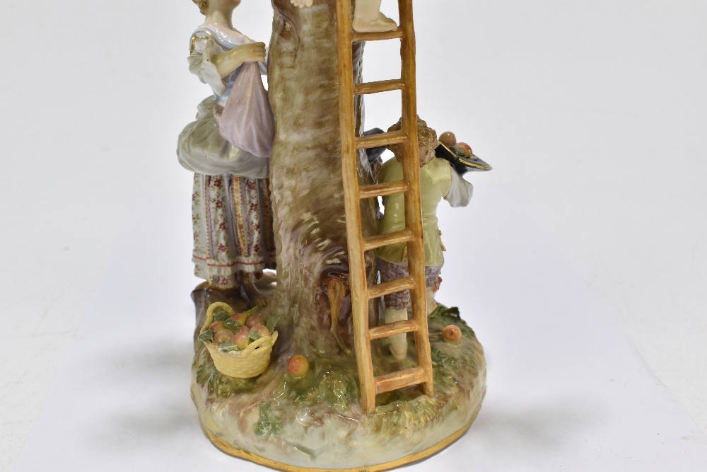 MEISSEN; an early 20th century figure group of a figure picking apples in an apple tree with three - Image 11 of 13