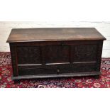 An early 18th century oak mule chest, with hinged top above a panelled front and one long drawer, on