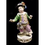 MEISSEN; an early 20th century figure of a portly young gentleman wearing elaborate clothing,