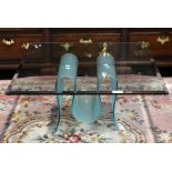 FIAM; an unusual good quality glass coffee table with square section top above shaped tinted base,