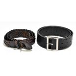 JOHJI YAMANOTO; a heavy black leather waist belt with cut out design, silver tone buckle and maker's