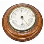 CHARLES HORNER; a 1920s circular oak barometer/thermometer, inscribed to the dial 'Chas Horner