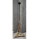 A large late 19th century telescopic brass standard lamp raised on tripartite base. Provenance: from