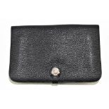 HERMÈS; a black togo bullhide leather Togo Dogan wallet waist pouch with snap opening front,