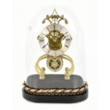 An early 20th century brass skeleton clock with applied silvered chapter ring with black Roman