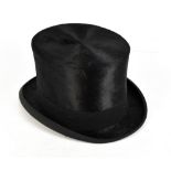 AUSTIN REED OF REGENT STREET; a gentleman's black silk and moleskin top hat lined with soft