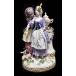 MEISSEN; a 20th century figure group of two young women wearing elaborate dress standing beside an