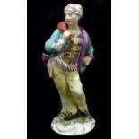 MEISSEN; an 18th century figure of a man holding a slapstick, height 13.5cm, painted mark to back of