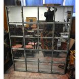 A large rectangular mirror formed from a metal window frame, 180 x 180cm.