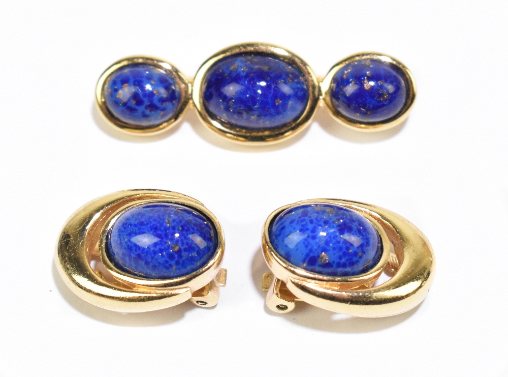 CHRISTIAN DIOR; a pair of gold tone vintage clip-on earrings with blue cabochon lapis lazuli stones,