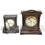 A late 19th century French black slate mantel clock, height 22cm and an early 20th century oak