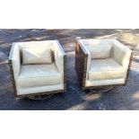 A pair of Art Deco style coromandel veneered and faux crocodile upholstered swivel tub chairs on